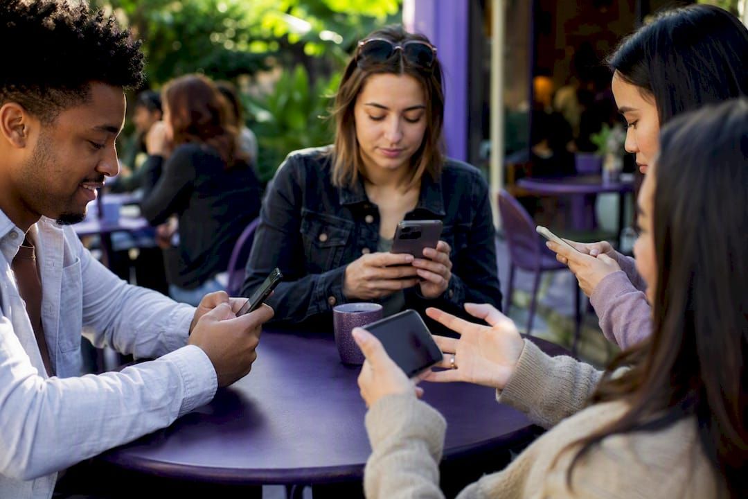 Diverse hands using smartphones in different ways
