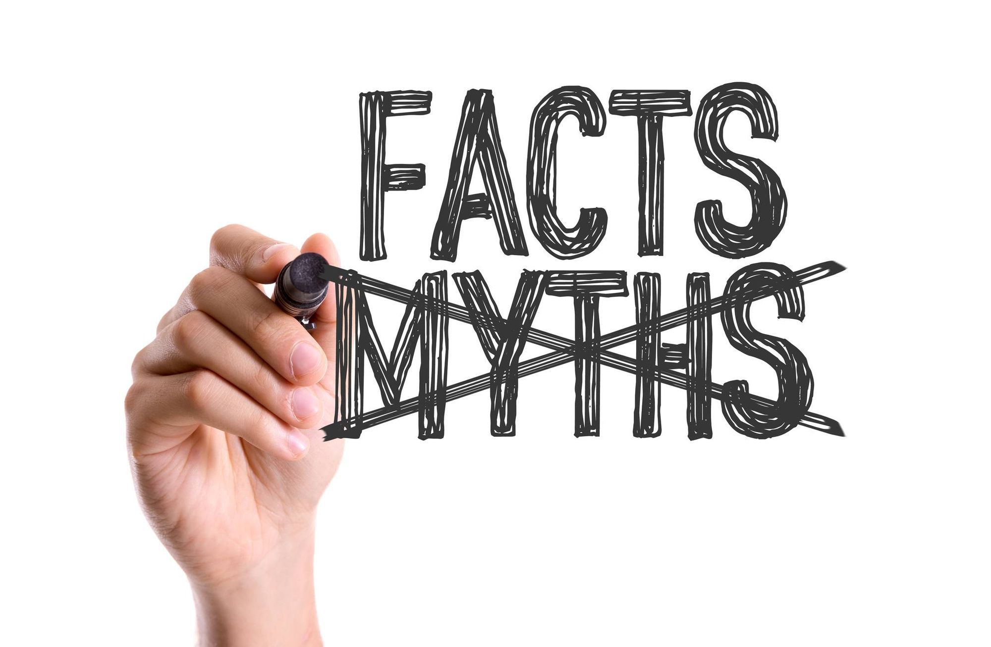 Hand crossing out the word Myths, written next to the word Facts