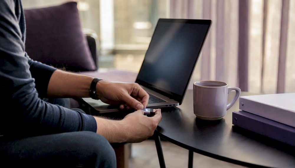 1786188058910_Hands-connecting-security-token-to-laptop.jpeg