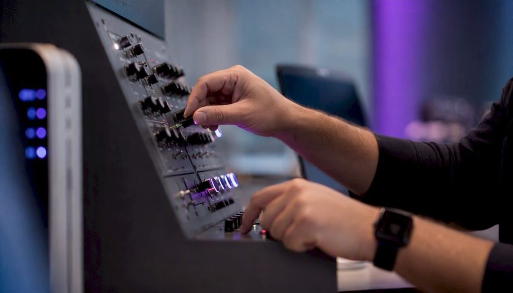 Hands adjusting AI model fairness controls