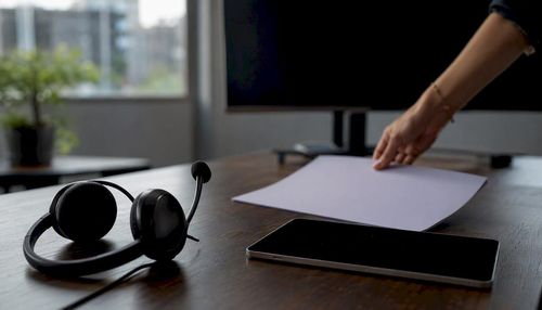 1786383139217_Headset-and-notebook-on-coaching-desk.jpeg