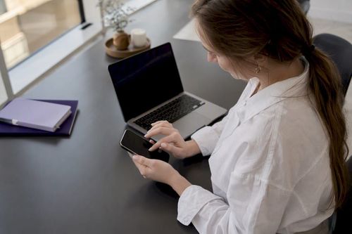 Hands setting up mobile device for user test