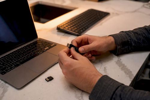 Hands setting up authentication security key